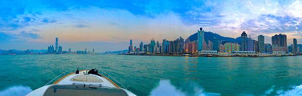 istock hong kong by boat at sunset panoramic 636151326