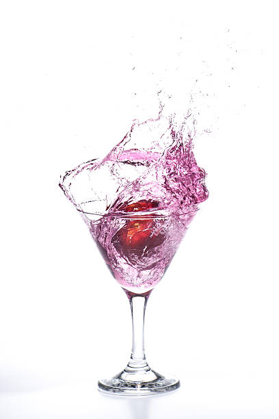 istock Apple falling and splashing in a martini glass 636153568