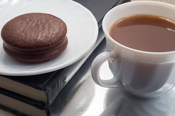 istock White cup of hot chocolate and a biscuit 636154348