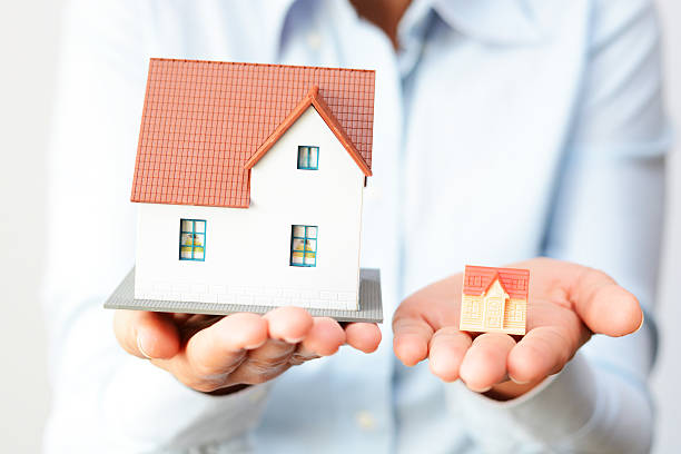Buying a small or a big house considering prices  difference stock photo