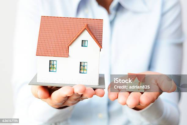 Buying A Small Or A Big House Considering Prices Difference Stock Photo - Download Image Now