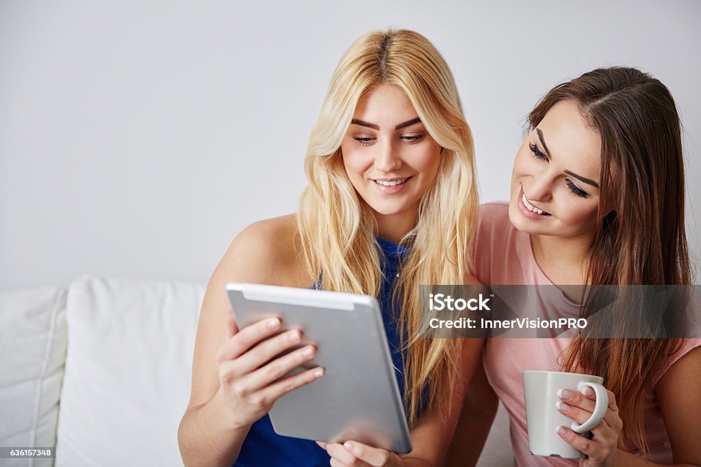Watching Funny Videos On Tablet Stock Photo - Download Image Now - Adult,  Arts Culture and Entertainment, Beautiful People - iStock