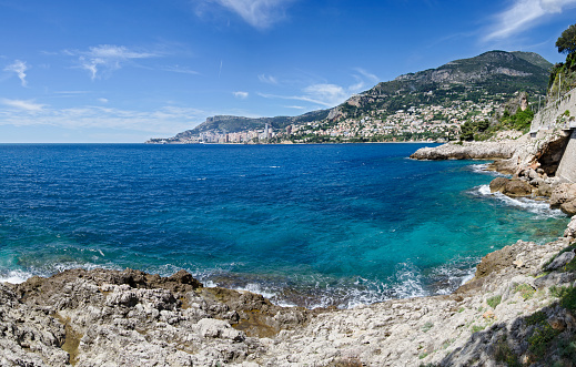 Panoramic wide angle view of Monaco from Roquebrune-Cap-Martin beach on the Cote d'Azur