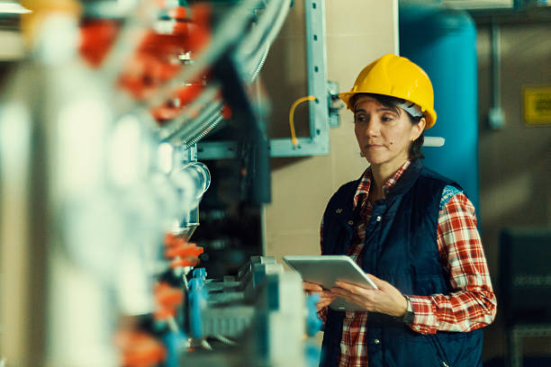 istock Technician working on valve in factory or utility 636163884