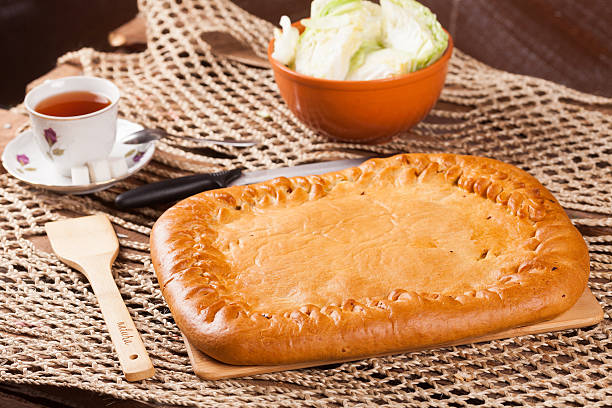 istock Pie on the table with food set 636166602