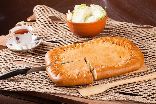 istock Pie on the table with food set 636166614