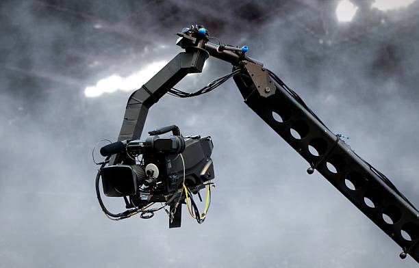 camera on crane shooting in a stadium - filmando com guindaste imagens e fotografias de stock