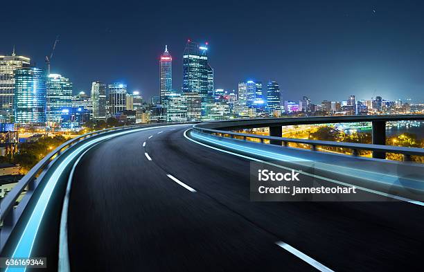 Highway Overpass Motion Blur With City Background Stock Photo - Download Image Now