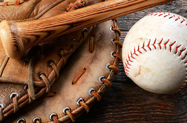 Baseball and Baseball Glove A top view image of an old used baseball, baseball glove, and baseball bat.  baseball sport stock pictures, royalty-free photos & images