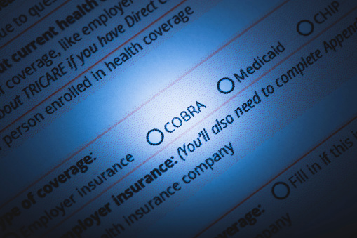 A stock photo of a US Healthcare / Health insurance application form. Photographed using Canon EOS 5DSR at 50mp. Focused on the words 