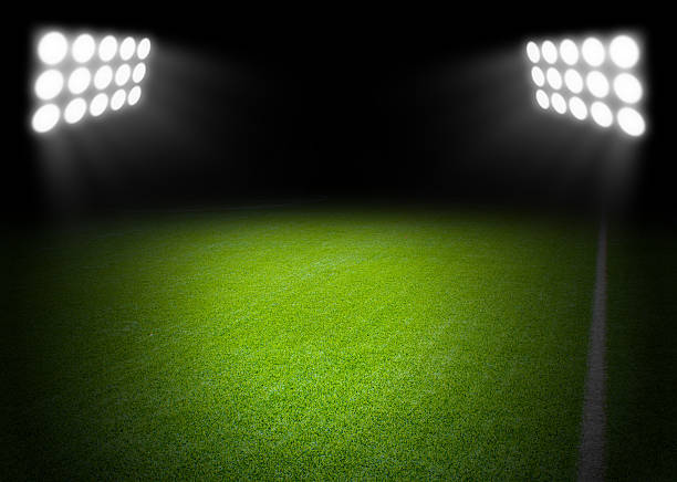 istock The football field with spotlight in stadium 636171784
