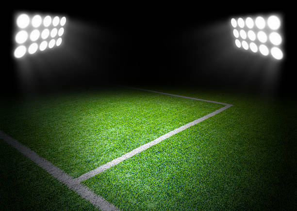 istock The football field with spotlight in stadium 636171848