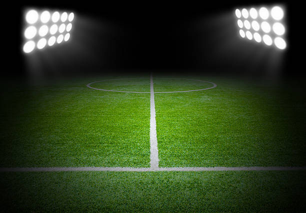 istock The football field with spotlight in stadium 636171900