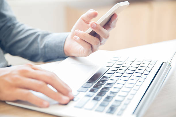 istock Businessman texting message sitting at laptop 636172758