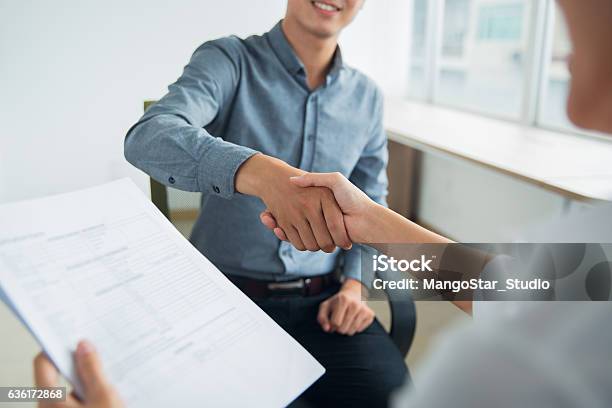 Smiling Asian Businessman Shaking Partners Hand Stock Photo - Download Image Now - Agreement, Business, Adult