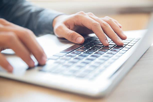 istock Hands of businessman typing on laptop keyboard 636172890
