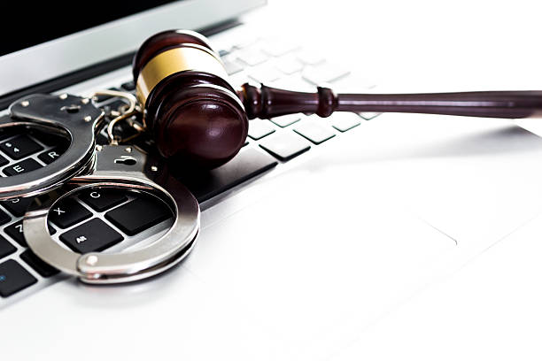 istock Gavel and handcuffs on laptop keyboard 636173378