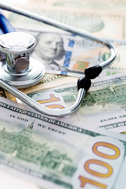istock Stethoscope on us paper currency 636174350
