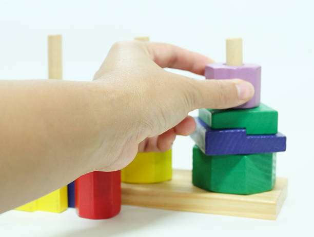 istock wooden toy on white background. 636174644