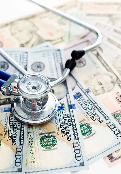 istock Stethoscope on us paper currency 636174750