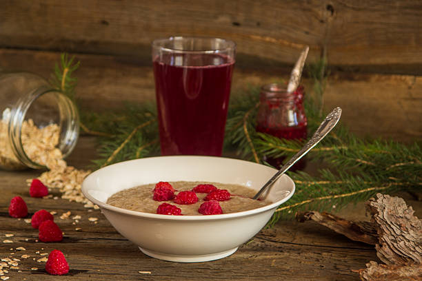 healthy breakfast, oatmeal porridge with raspberries and beverag - beverag imagens e fotografias de stock