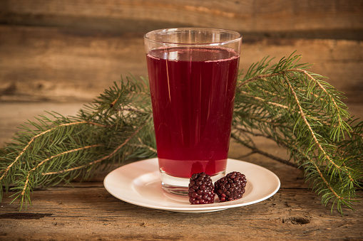 Healthy everage with black and red raspberries on the wooden