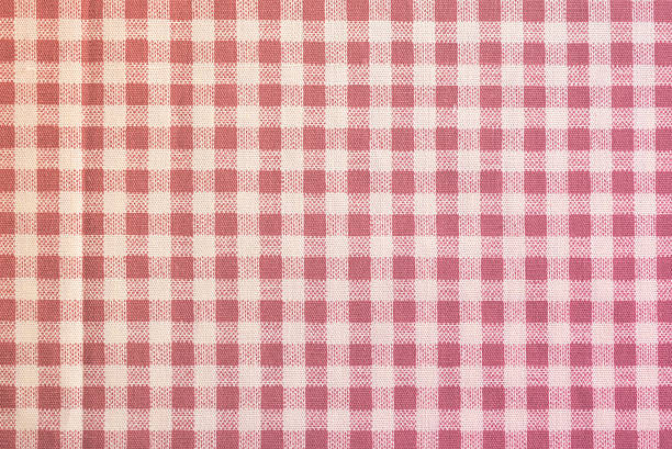 istock the checkered tablecloth on wooden background. Use for background. 636180202