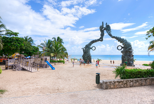Playa del Carmen, Mexico - November 8, 2016: A playground for children in front of the Mayan monument on the beach makes Playa del Carmen a family-friendly Mexican Riviera travel destination.