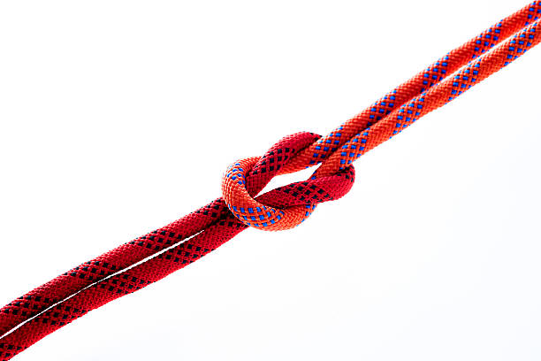 istock Rope with reef knot isolated on white background 636184238