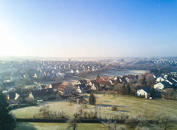 Aerial view over Rommelsbach, northern district of Reutlingen on a sunny winter morning with hoarfrost on the meadows and gardens, Reutlingen, South Germany, Baden Württemberg, Germany.