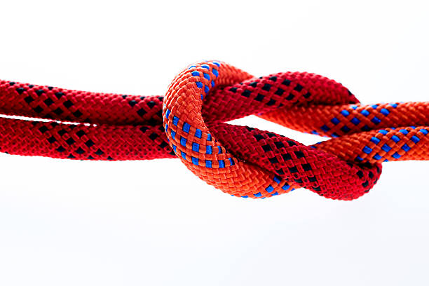 istock Rope with reef knot isolated on white background 636184316