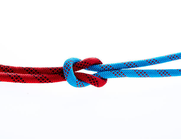 istock Rope with reef knot isolated on white background 636184584