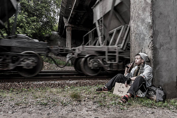 istock Homeless woman near the rail track 636184792