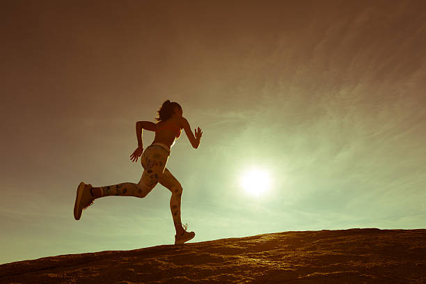 istock Hispanic Women Running Up A Granite Boulder 636184842
