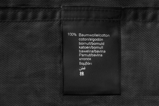 Fabric composition label on black cotton as a background