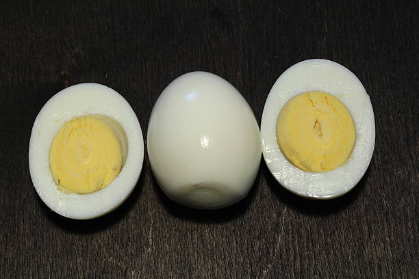 istock Fresh eggs on wood black background. Copy space. Top view 636187262