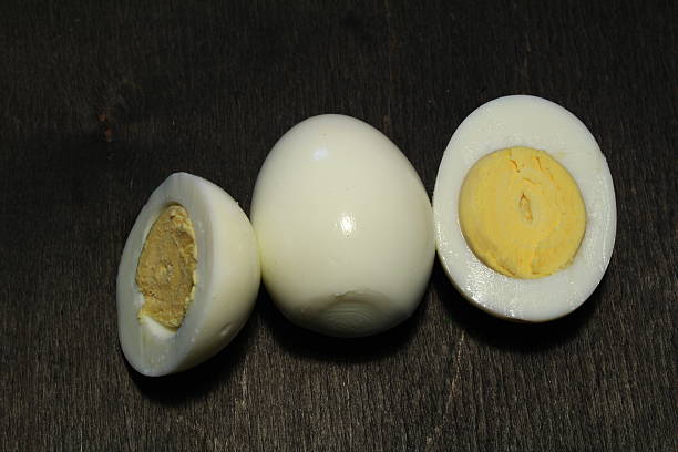 istock Fresh eggs on wood black background. Copy space. Top view 636187366