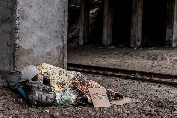 istock Homeless woman sleeping 636187858