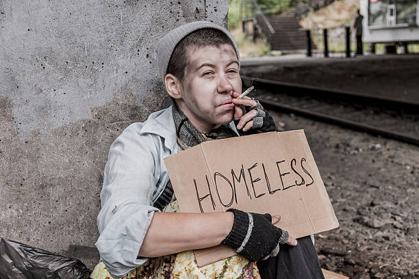 istock Homeless woman smoking 636188968
