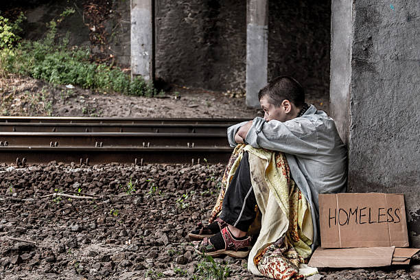 istock Desperate homeless woman 636189140