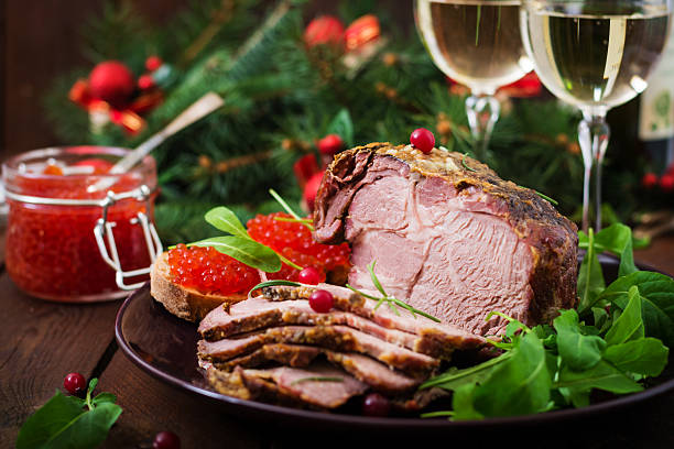 istock Christmas baked ham and red caviar 636191200