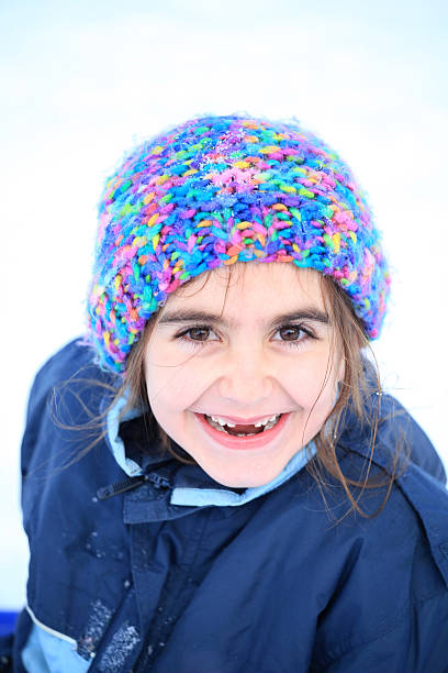 istock Happy girl in winter - vertical image 636191948