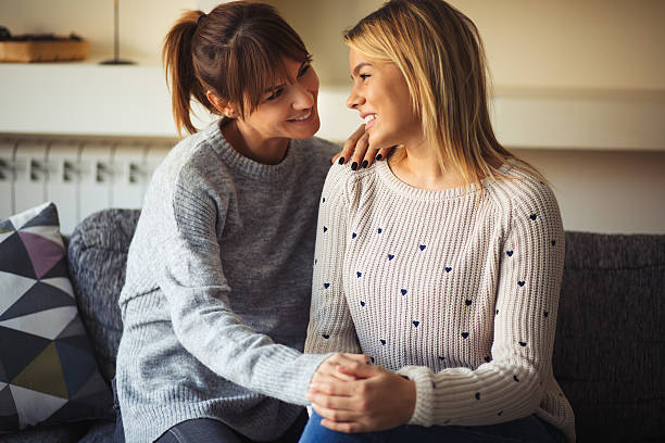 istock Smiling lesbian couple relaxing at home and communicating. 636192336