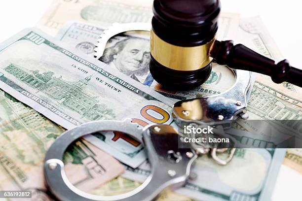 Judges Gavel And Handcuffs On American Dollars Stock Photo - Download Image Now - Money Laundering, White Collar Crime, Currency