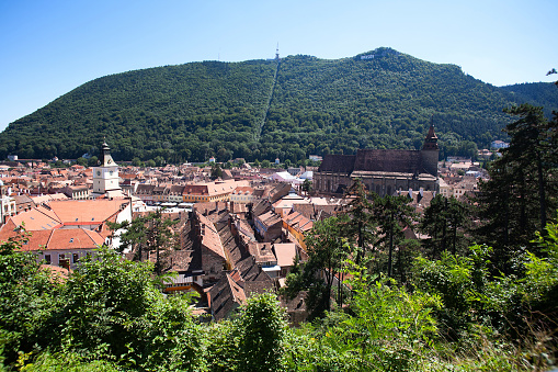 Brasov city surrounded by forest and hills