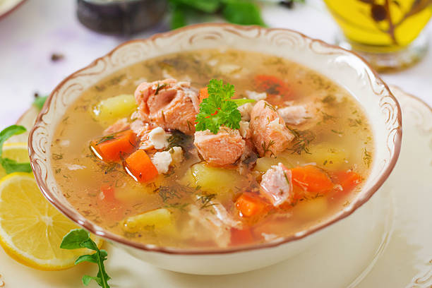 istock Salmon soup with vegetables in bowl 636194416
