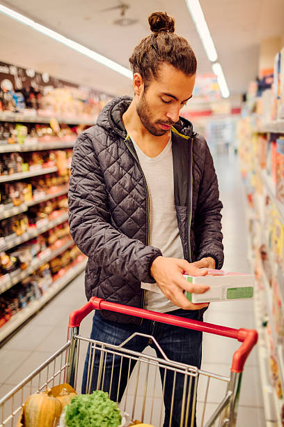 Young Bearded Man In A Supermarket. stock photo