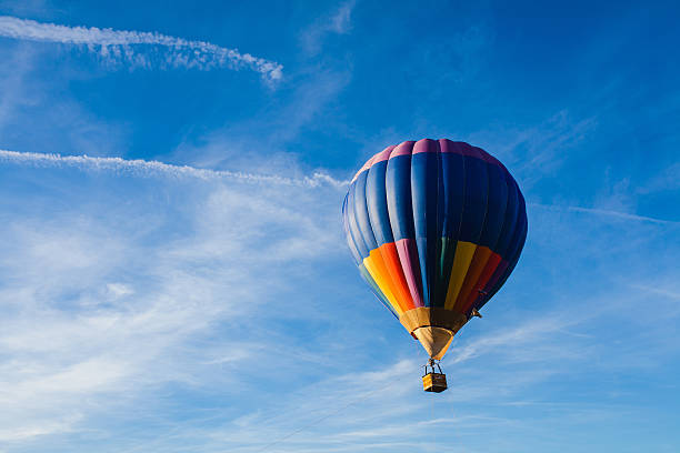 istock Colorful hot air balloon in blue sky 636195480