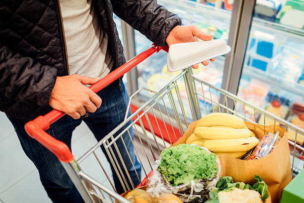 istock Young Man In A Supermarket. 636195934