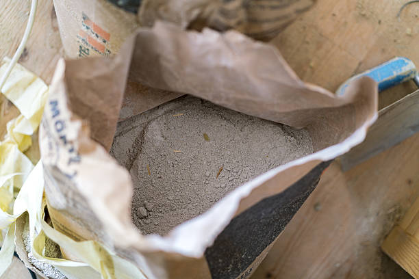 istock Opened bag of dry cement 636196946